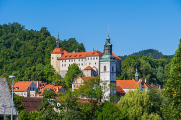 Fototapeta na wymiar Town of Skofja Loka in Slovenia, townscape with castle and tower of St. Jacob Church, in Upper Carniola region.