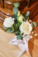 A beautiful wedding bouquet of white roses. Preparation for the wedding.