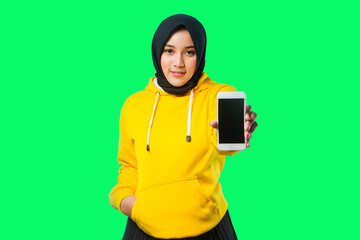 beautiful asian moslem girl smile and holding her phone