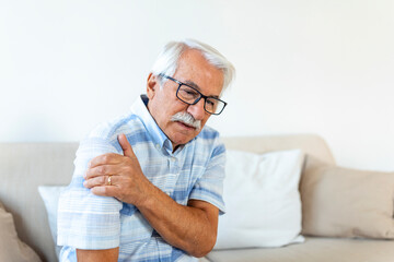Old senior man with shoulder pain. Upset senior elder man feel sudden back pain muscles ache...