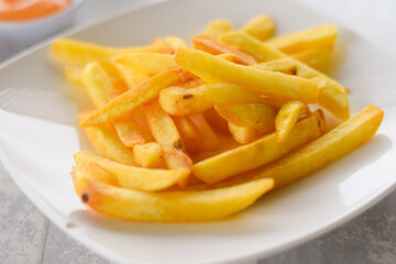 French fries or potato chips on white dish