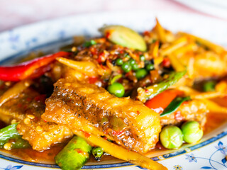 Stir Fried Spicy Fish in white plate,Traditional Thai Food, Diner in Restaurant,Cooking Seaffood Spicy Asian.