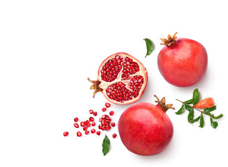 Flat lay of ripe pomegranate with cut in half isolated on white background.