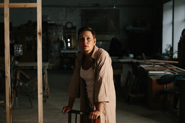 Fototapeta na wymiar A mature woman poses in a film studio.