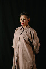 Dramatic portrait of a mature woman. Low key.