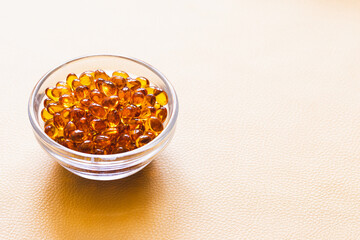 Vitamin D3 capsules. Medicine vitamins and dietary supplements. Selective focus. Close up of oil filled capsules suitable for: fish oil, omega 3, omega 9, vitamin A, vitamin D, vitamin D3, vitamin E