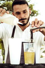 a barman preparing drinks