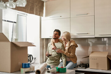 Young multiethnic couple resting and drinking tea