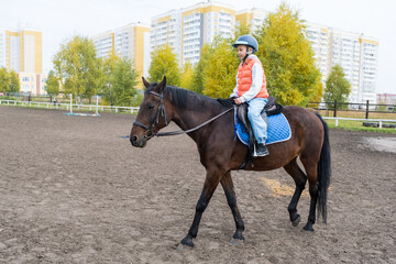 girl learning to ride a horse