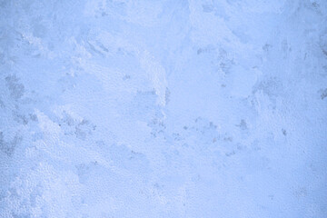 Christmas background. Ice on the window, frosty pattern on the glass.