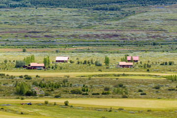 Fototapeta na wymiar birds eye view over the valley of Bláskógabyggð with tiny wooden houses, Iceland
