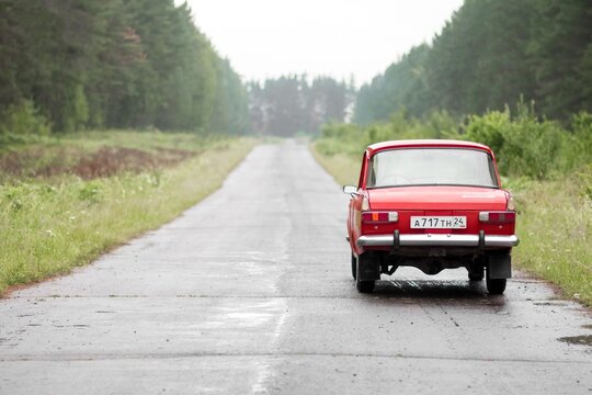 KRASNOYARSK, RUSSIA - July 14, 2020: Red retro car Moskvich 412. Whitewalls. Car of the year 1982