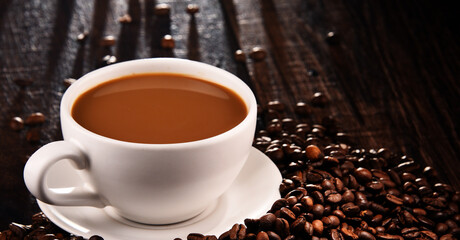 Composition with cup of coffee and beans