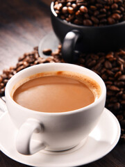 Composition with two cups of coffee and beans