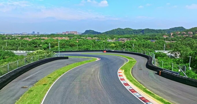 Aerial footage of asphalt road and green forest natural scenery