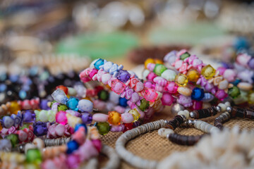 Many colorful bracelets from handcraft souvenirs shop