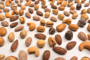  A group of almonds, pistachios, walnuts, macadamia, cashews.