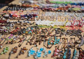 Fototapeta premium Many colorful bracelets from handcraft souvenirs shop