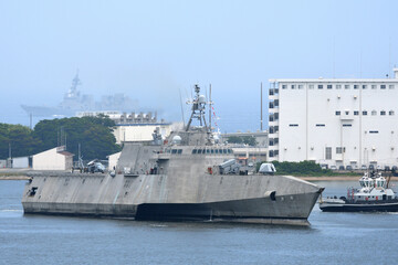 Stealth warship entering port.