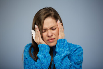 Woman sick with cold or flu has headache. Isolated female studio portrait with eyes closed.