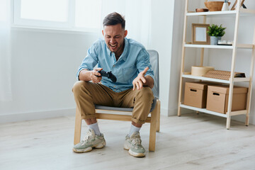 Aggressive young tanned gamer scream at joystick gamepad loosing mission at home. Player Stream Platform for gamers concept. Relaxing Active recreation. Copy space for game console advertising © SHOTPRIME STUDIO