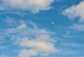 Naklejka na ściany i meble Blue sky with clouds and moon