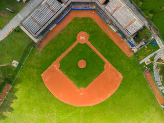 Drone Aerial View flying above a outdoor Baseball Field Diamond. - Powered by Adobe