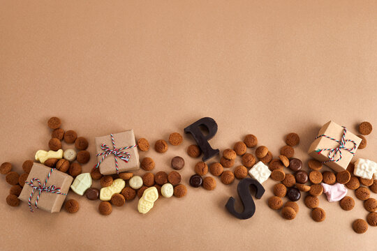 Saint Nicholas - Sinterklaas day. Traditional sweets on caramel background