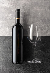 Bottle and glass of red wine.