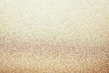 Close-up on a golden metal plate with reflections for background and photomontage