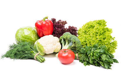 Variety of organic vegetables cabbages, bell pepper and leafy greens isolated on white