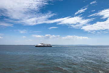 Tour boat sailing on the sea in Lisbon