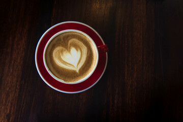 the red cup coffee love , coffee dark in wood dark table