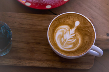 coffee latte art on wood table , coffee for idea