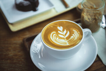 coffee aroma latte cup in the wood table cafe style