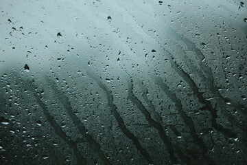 rain drops on glass background the back is natural