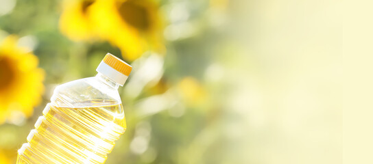 Bottle of sunflower oil on blurred background with space for text, closeup