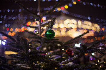 Christmas tree on the background of the lights of the night city