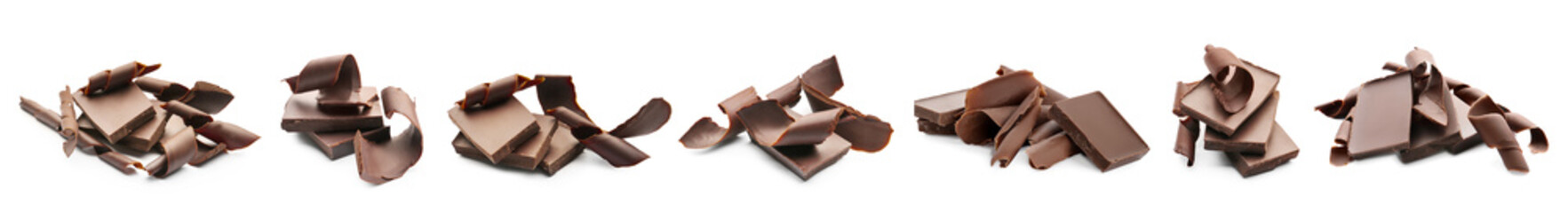 Set of sweet chocolate curls and pieces on white background