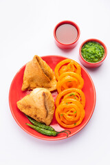 Veg Samosa with Jalebi, snack combination also called imarti and Sambusa, samusa