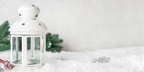 Beautiful Christmas lantern and snow on light background with space for text