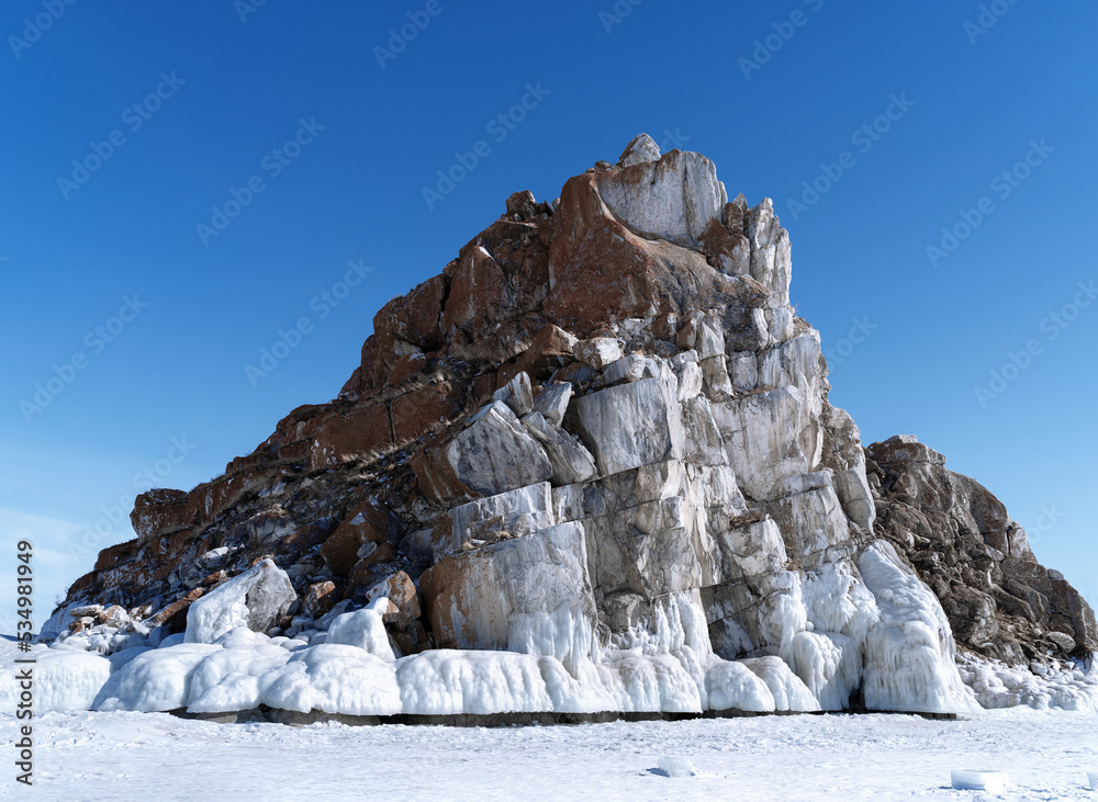 Wall mural beautiful winter landscape with blue ice cave grotto and frozen clear icicles. lake baikal, russia. 