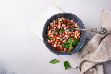 Bowl of vegetarian healthy meal with beans and tomato sauce
