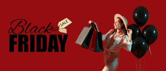 Happy young woman with shopping bags and balloons on red background. Black Friday sale