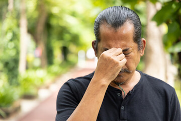 sick asian senior man suffering from headache, concept of health and sickness concept for vertigo...