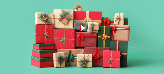 Different Christmas presents on green background