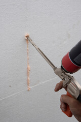 thermal insulation house. Thermal insulation panels in white and adhesive in orange for thermal...