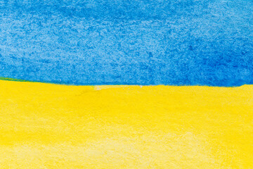 Flag of Ukraine painted with watercolors. Macro close-up of blue and yellow watercolour painting. Textured aquarelle paper background with copy space.