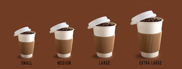 Different sized takeaway coffee cups on brown background