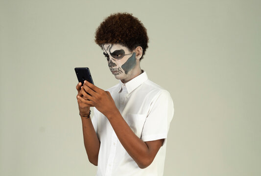 catrin teen with afro hair, cell phone, Santa muerte concept